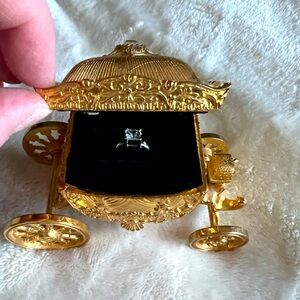 Cinderella-like Coach Ring Holder with Velvet Ring inside and moveable wheels.